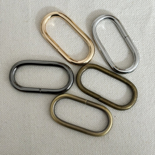 Anneaux ouverts ovales fil demi-jonc 6x4x2 mm - Doré à l'or fin x20 - Perles & Co Anneaux ouverts ovales fil demi-jonc 6x4x2 mm - Doré à l'or fin x20 - Perles & Co